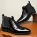 Bottines Chelsea en cuir noir avec empiècement effet python