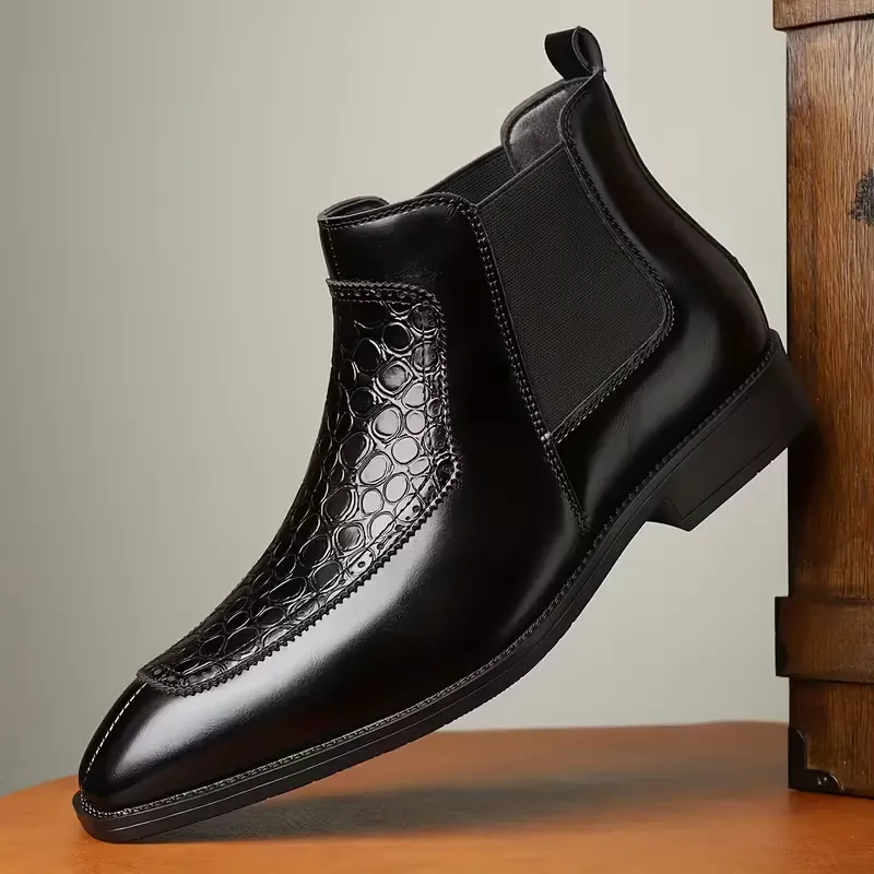 Bottines Chelsea en cuir noir avec empiècement effet python