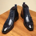 Bottes montantes cap toe brogue en cuir noir pour homme – vue de profil